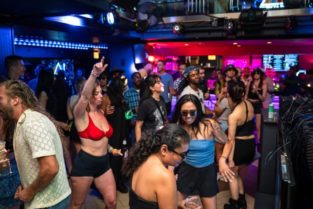 Guests moving from Masada’s courtyard into the main dance floor as the evening heats up. The transition captures the shift from a relaxed outdoor party to a high-energy nightlife experience. Vibrant lights and music set the tone for an unforgettable night in Chicago.