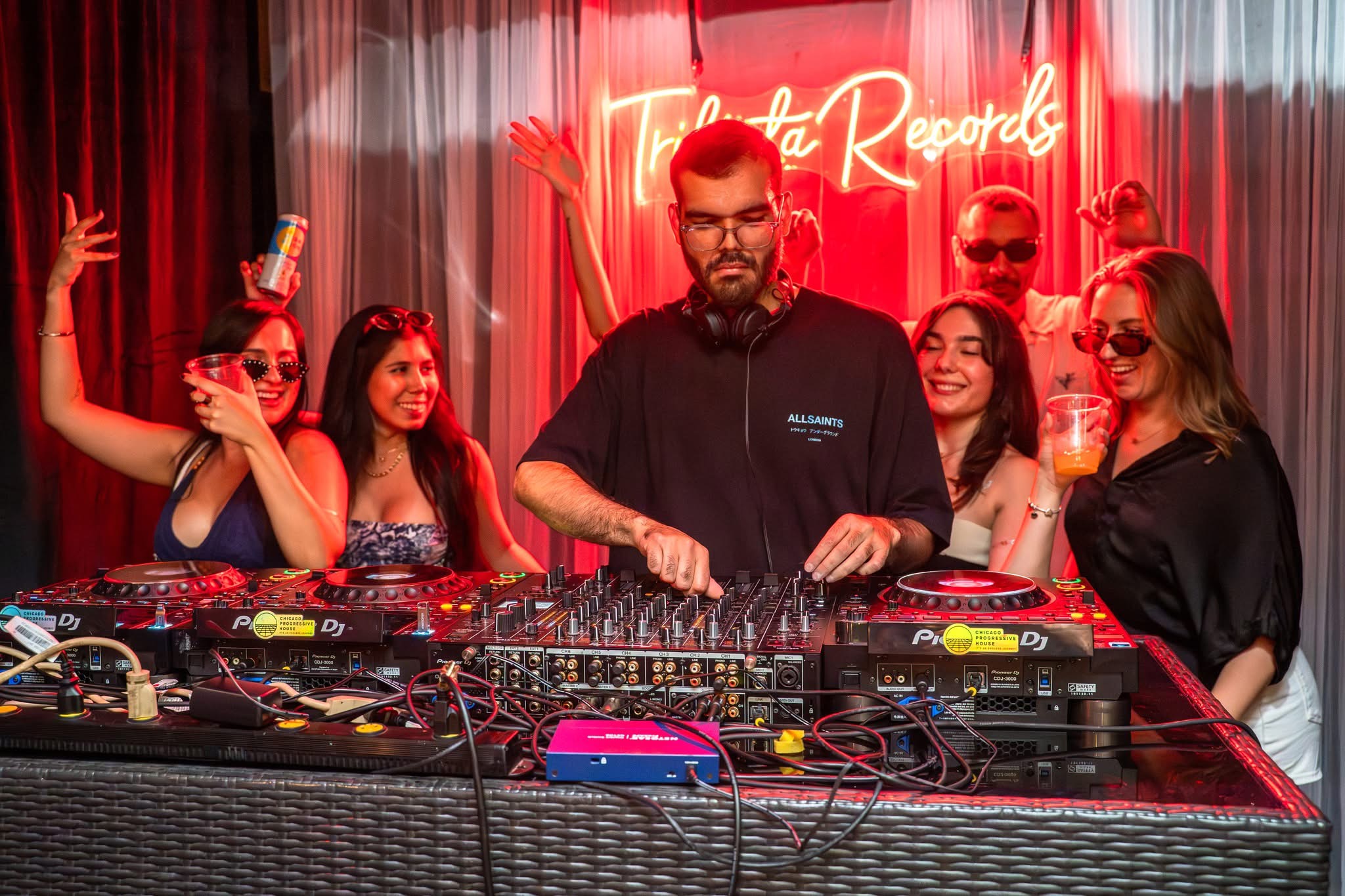 DJ Herrera on the decks playing music for the courtyard crowd at Masada Nightclub
