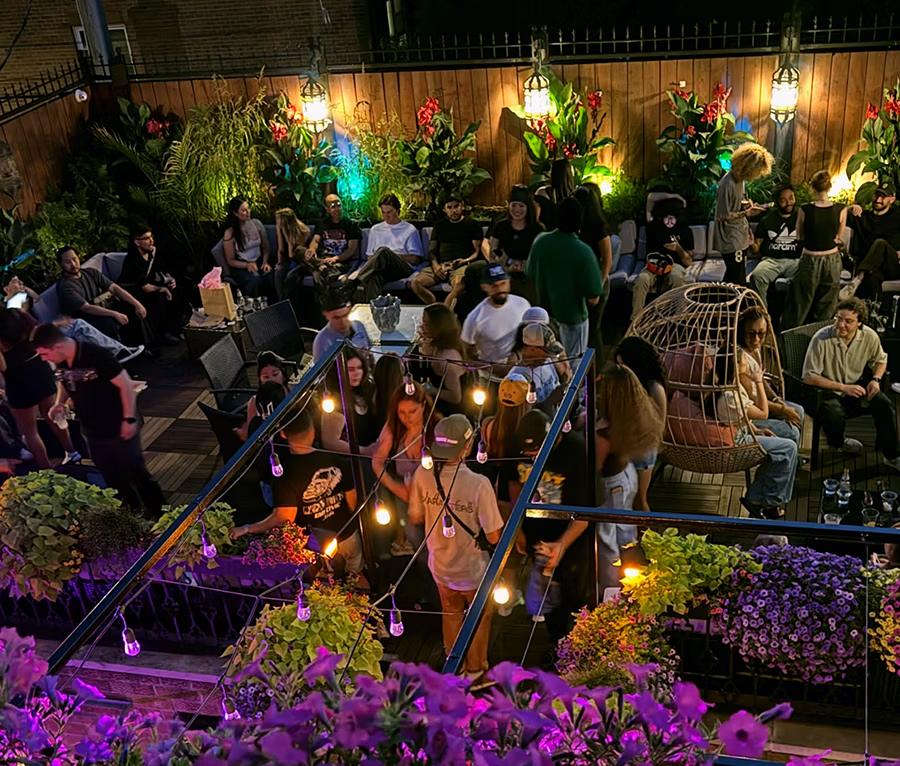 Guests gathering on Masada’s rooftop during Industry Mondayz